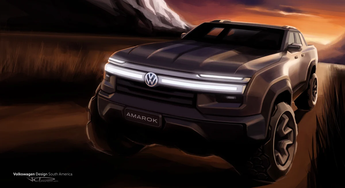 Teaser oficial da nova Volkswagen Amarok em três quartos dianteiros num descampado ao entardecer, com faixa de luz atravessando a grade e a palavra Amarok no para-choque — desenho assinado pelo Volkswagen Design South America